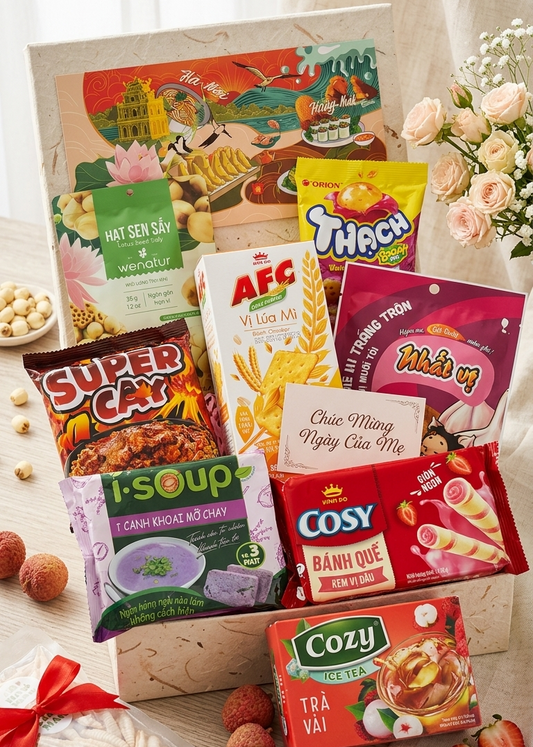 Assorted Vietnamese snacks and drinks in a box with decorative elements.